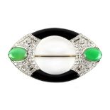 Boucheron - a fine Art Deco black onyx jadeite & diamond navette shaped brooch, circa 1925, with two