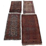 Property of a deceased estate - four early 20th century Belouch rugs including a prayer rug, the