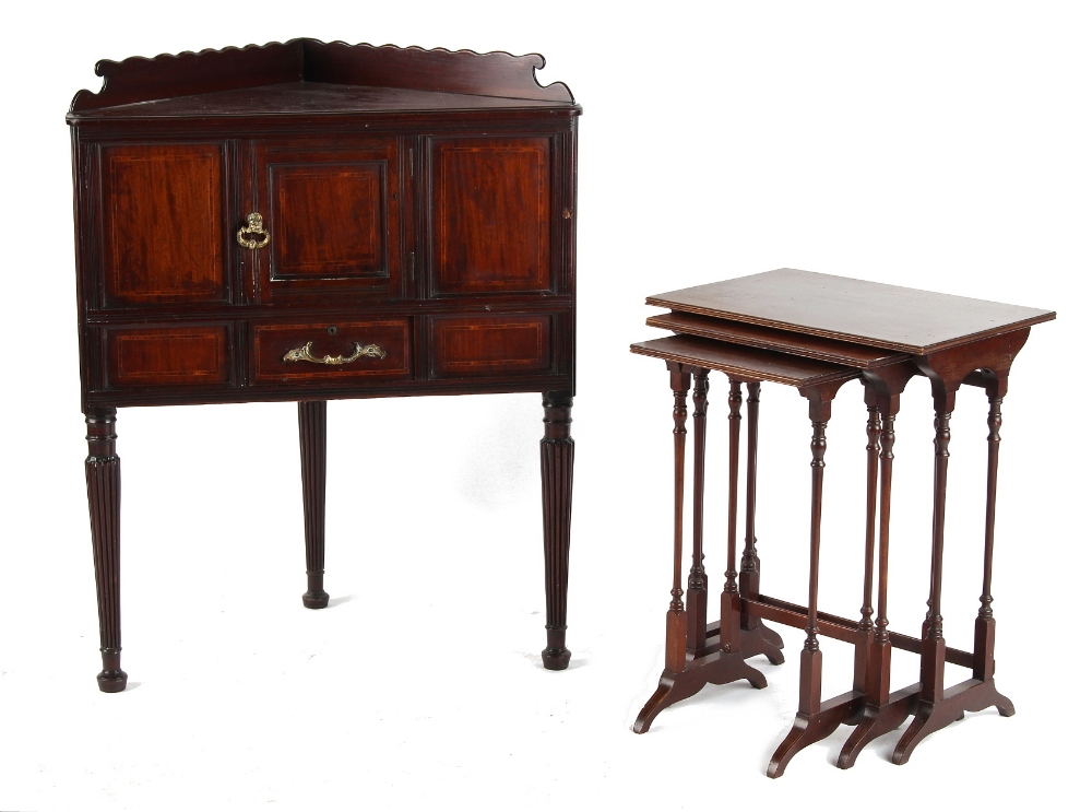 Property of a lady - a nest of three Edwardian mahogany & strung occasional tables, the largest