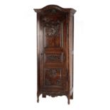 Property of a deceased estate - an 18th century French carved chestnut bonnetiere, 32.6ins. (83cms.)