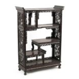 A Chinese carved hongmu display cabinet, late 19th / early 20th century, with open shelves, 45.3ins.