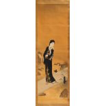 An early 20th century Japanese scroll painting on silk depicting a bijin standing on a bridge,