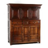 Property of a deceased estate - an 18th century oak two-part court cupboard, of pegged construction,