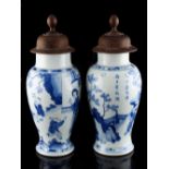 Property of a lady - a pair of Chinese blue & white baluster vases, Kangxi period (1662-1722), one