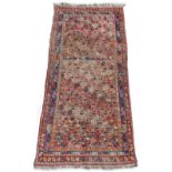 Property of a deceased estate - an early 20th century Caucasian long rug, with all-over field, 88 by