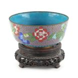 Property of a lady - a Japanese cloisonne bowl, decorated with flowers, 4.3ins. (11cms.) diameter,