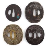 A collection of Japanese tsubas, 18th and 19th century, mixed metals - four assorted tsubas, one