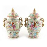 Property of a lady - a pair of late 19th century Chinese Canton famille rose two-handled baluster