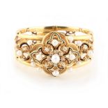 An unmarked Victorian high carat yellow gold black enamel diamond & pearl adjustable bangle,
