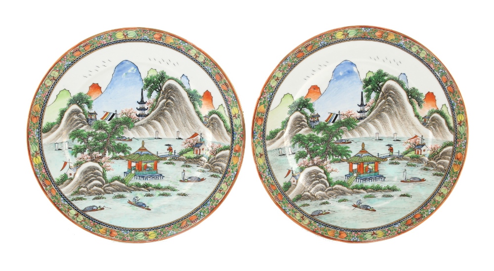 Property of a lady - a pair of Chinese Republic period plates, each painted with a landscape with