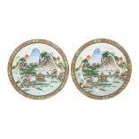 Property of a lady - a pair of Chinese Republic period plates, each painted with a landscape with