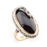 An unusual early 20th century cabochon amethyst & diamond snake ring, with ruby eyes,