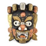 Property of a gentleman - a carved wood, tin, copper & brass clad Mahakala mask, 11.8ins. (30cms.)