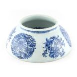 An unusual 18th century Chinese blue & white dish ring, 8.6ins. (21.8cms.) diameter.