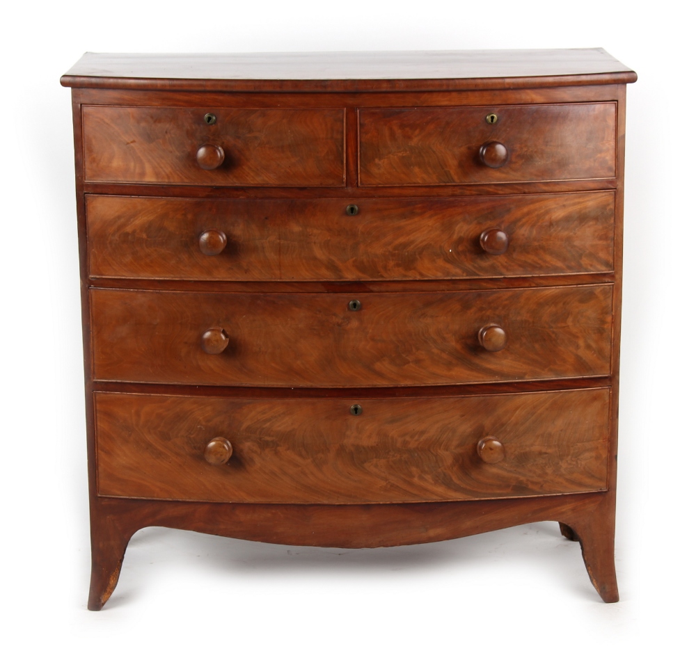 Property of a deceased estate - an early 19th century mahogany bow-fronted chest of two short &