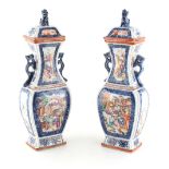 A pair of 18th century Chinese famille rose mandarin pattern rectangular baluster vases & covers,