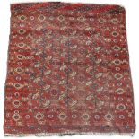 Property of a deceased estate - an early 20th century Turkoman rug, 49 by 44ins. (125 by 112cms.).