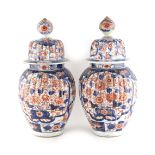 Property of a lady - a pair of 19th century Japanese Imari ribbed vases or jars & covers, 13.