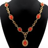 A heavy 18ct yellow gold & coral pendant necklace, 25.6ins. (65cms.) long, approximately 141.3
