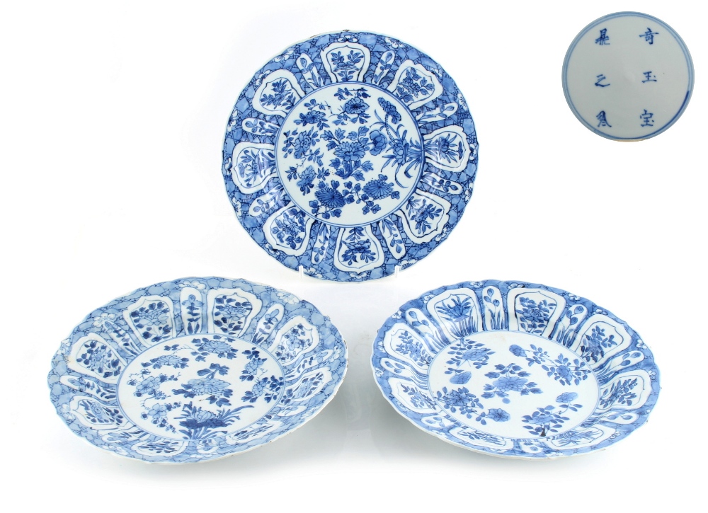 Property of a lady - a set of three Chinese blue & white plates, 6-character Xuande marks but Kangxi