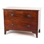 Property of a gentleman - an early 19th century mahogany chest of two long drawers, on swept bracket