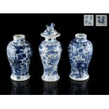 Property of a lady - a pair of 19th century Chinese blue & white baluster vases, each painted with