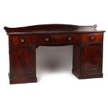 Property of a gentleman - an early 19th century Regency period mahogany twin pedestal sideboard,
