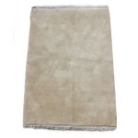 A Shiraz woollen hand-made rug with beige ground, 56 by 38ins. (140 by 95cms.).