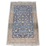 Property of a gentleman - a Persian Qum rug with pale blue & ivory ground, 79 by 49ins. (210 by