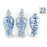 Property of a lady - three 19th century Chinese blue & white baluster vases with two covers, each