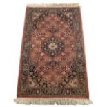 Property of a gentleman - a modern Persian hand knotted wool rug, 62 by 38ins. (158 by 97cms.).