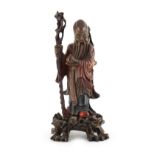 Property of a lady - a Chinese carved & lacquered wood figure of Shoulao, circa 1900, modelled