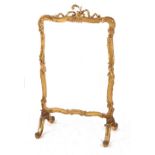 Property of a lady - a Victorian giltwood & composition firescreen, with glazed panel, 46ins. (