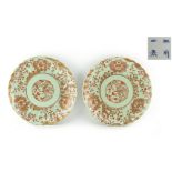A pair of Japanese porcelain celadon ground plates, circa 1900, decorated in gilt & iron red with