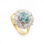 An 18ct yellow gold zircon & diamond cluster ring, the round cut zircon weighing an estimated 2.89