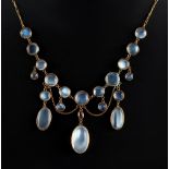 An attractive moonstone & ruby festoon necklace, 16.25ins. (41cms.) long.