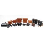 Property of a gentleman - a group of thirteen pairs of binoculars, mostly case, including Praktica
