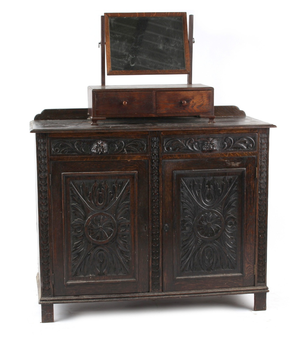 Property of a deceased estate - a late 19th / early 20th century dark oak side cabinet, 48ins. (