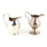 Two Georgian silver cream jugs, one marked London 1799, the other with rubbed marks, the taller 4.