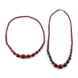 Property of a lady - two cherry amber bead necklaces, one with faceted beads (2).