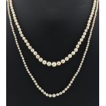 Property of a lady - two graduated single strand pearl necklaces, the largest pearl approximately