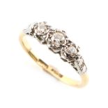Property of a gentleman - an 18ct yellow gold diamond three stone ring, approximately 2.3 grams,