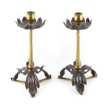 Property of a deceased estate - a pair of copper & brass foliate candlesticks, attributed to W.A.