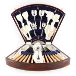 Property of a gentleman - an early 20th century silver plated cutlery set, in inlaid canteen.