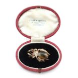 An unusual 9ct yellow gold tiger's eye diamond & ruby brooch modelled as a stag beetle, French
