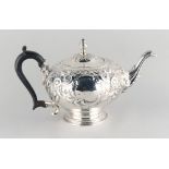 Property of a lady - a George II silver bullet shaped teapot, of good grade, with 'C'-scroll &