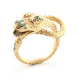 An unmarked Far Eastern high carat yellow gold (tests 18ct-22ct) snake ring, set with turquoise &