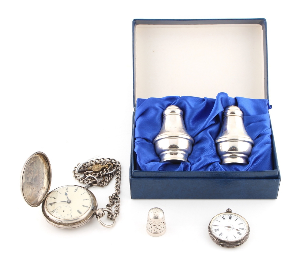 Property of a lady - a boxed pair of silver salt & pepper pots; together with a silver pocket