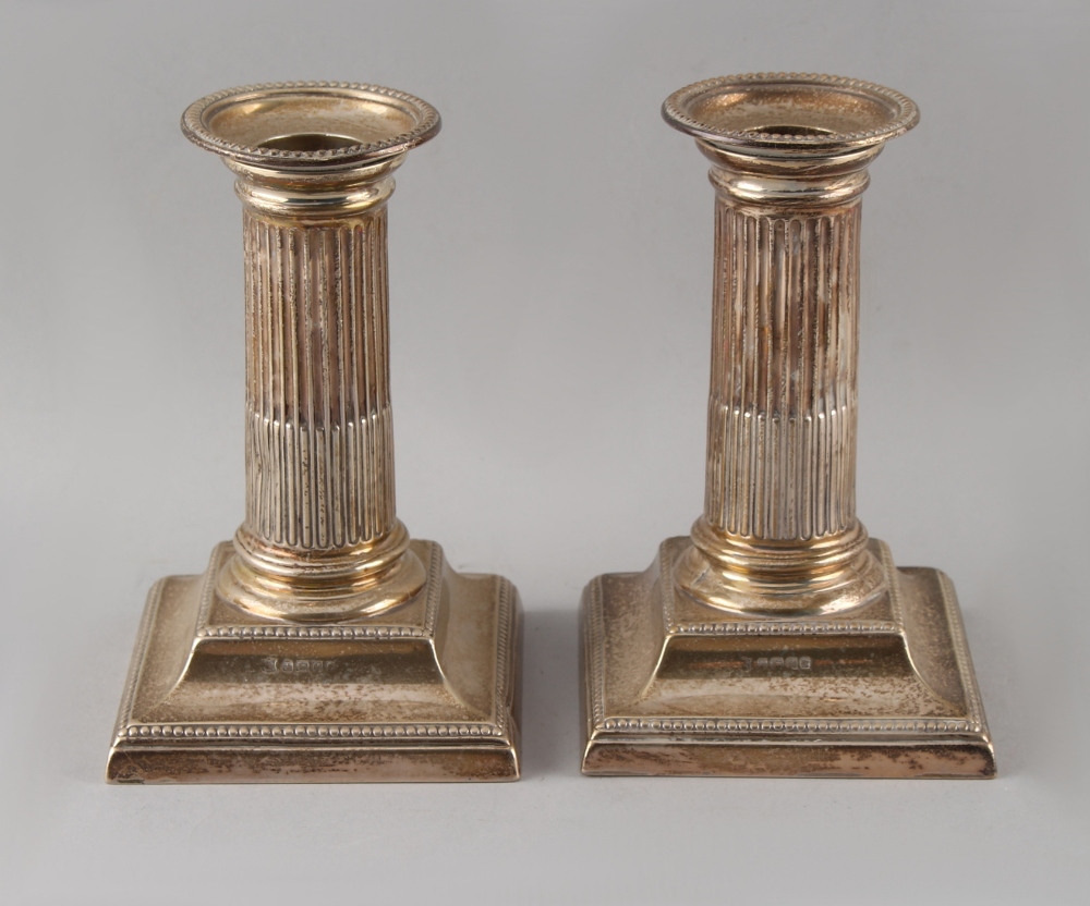 Property of a deceased estate - a pair of Victorian silver dwarf candlesticks, with square bases &