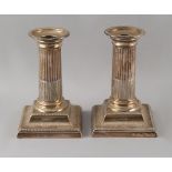 Property of a deceased estate - a pair of Victorian silver dwarf candlesticks, with square bases &